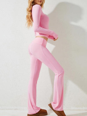 a woman in a pink outfit posing for a picture