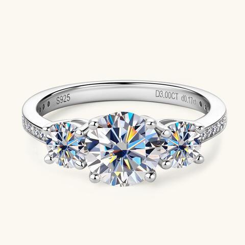 a three stone engagement ring with three diamonds