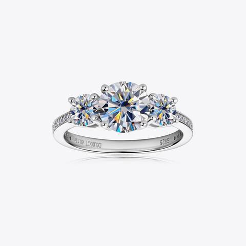 a three stone engagement ring with three diamonds