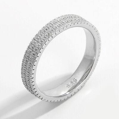 a white gold ring with rows of diamonds