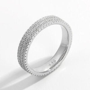 a white gold ring with rows of diamonds