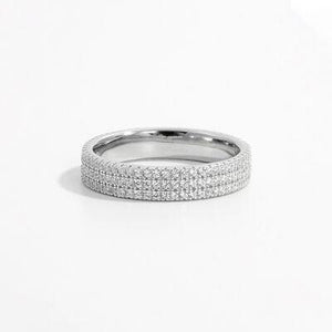 a white gold wedding band with pave set diamonds