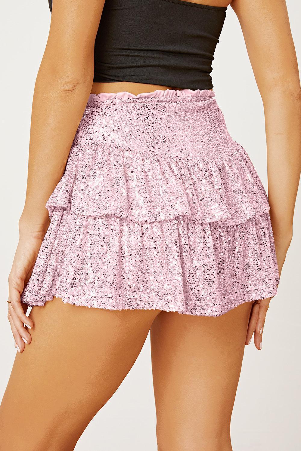 a close up of a woman wearing a pink skirt