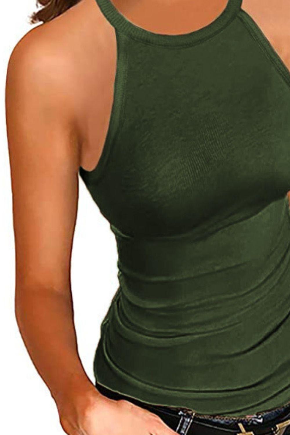 a woman wearing a green tank top