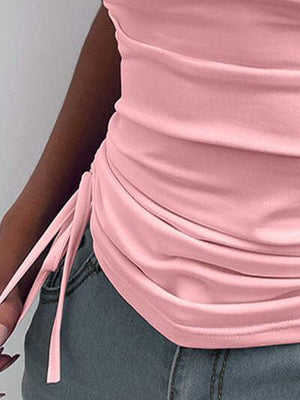 a close up of a person wearing a pink shirt