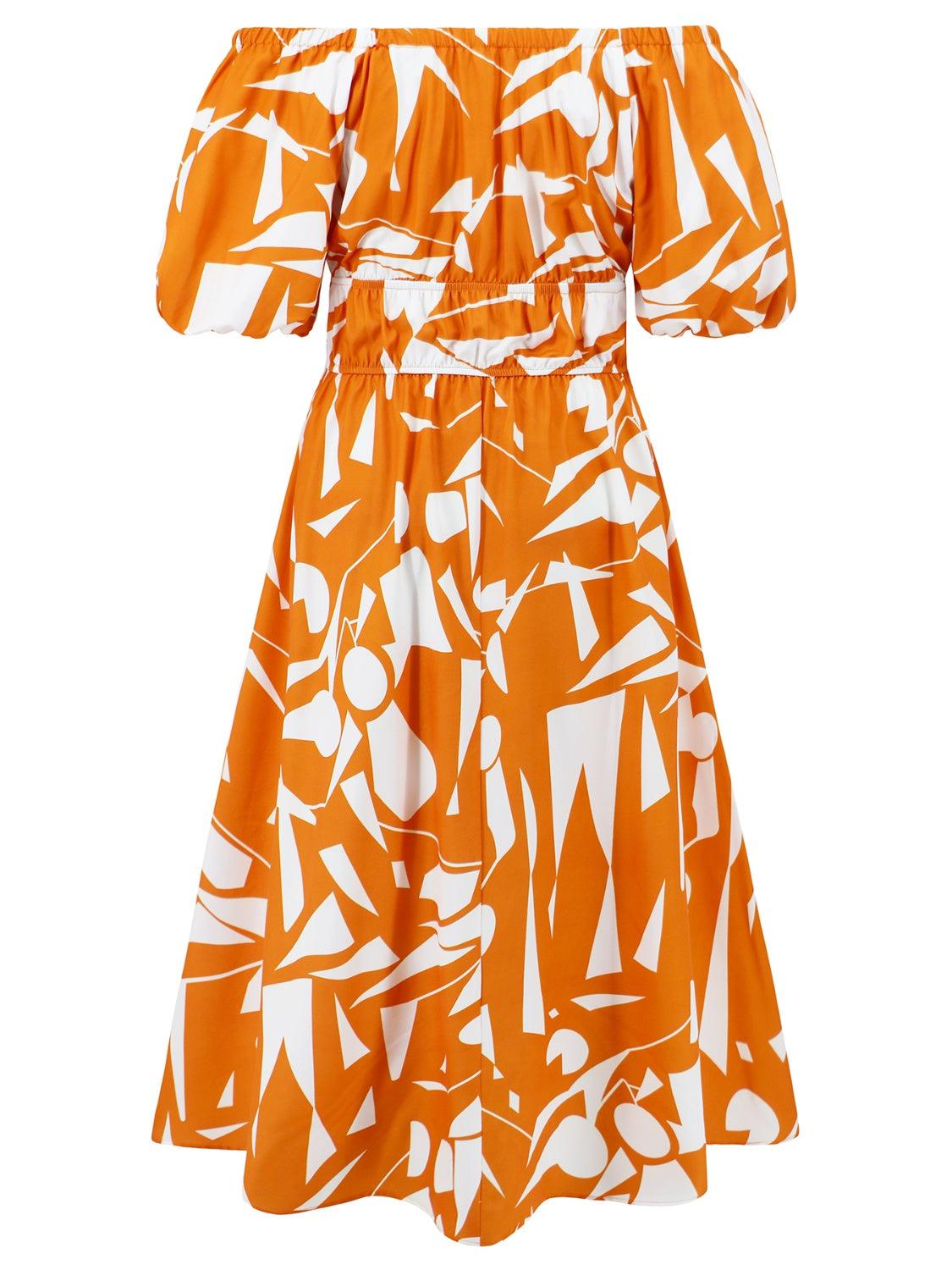 an orange and white dress with a pattern on it