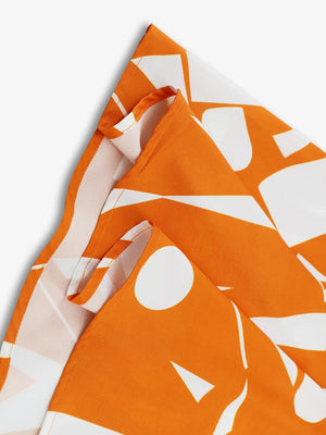 a close up of an orange and white scarf