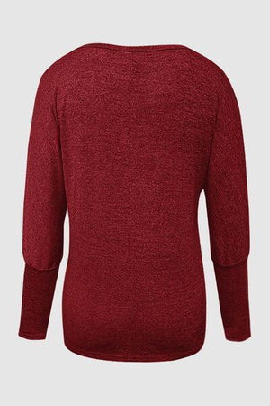 a women's red sweater with long sleeves