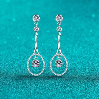a pair of earrings on a blue background