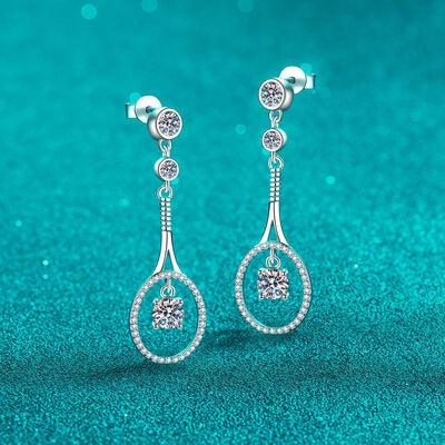 a pair of earrings on a blue background