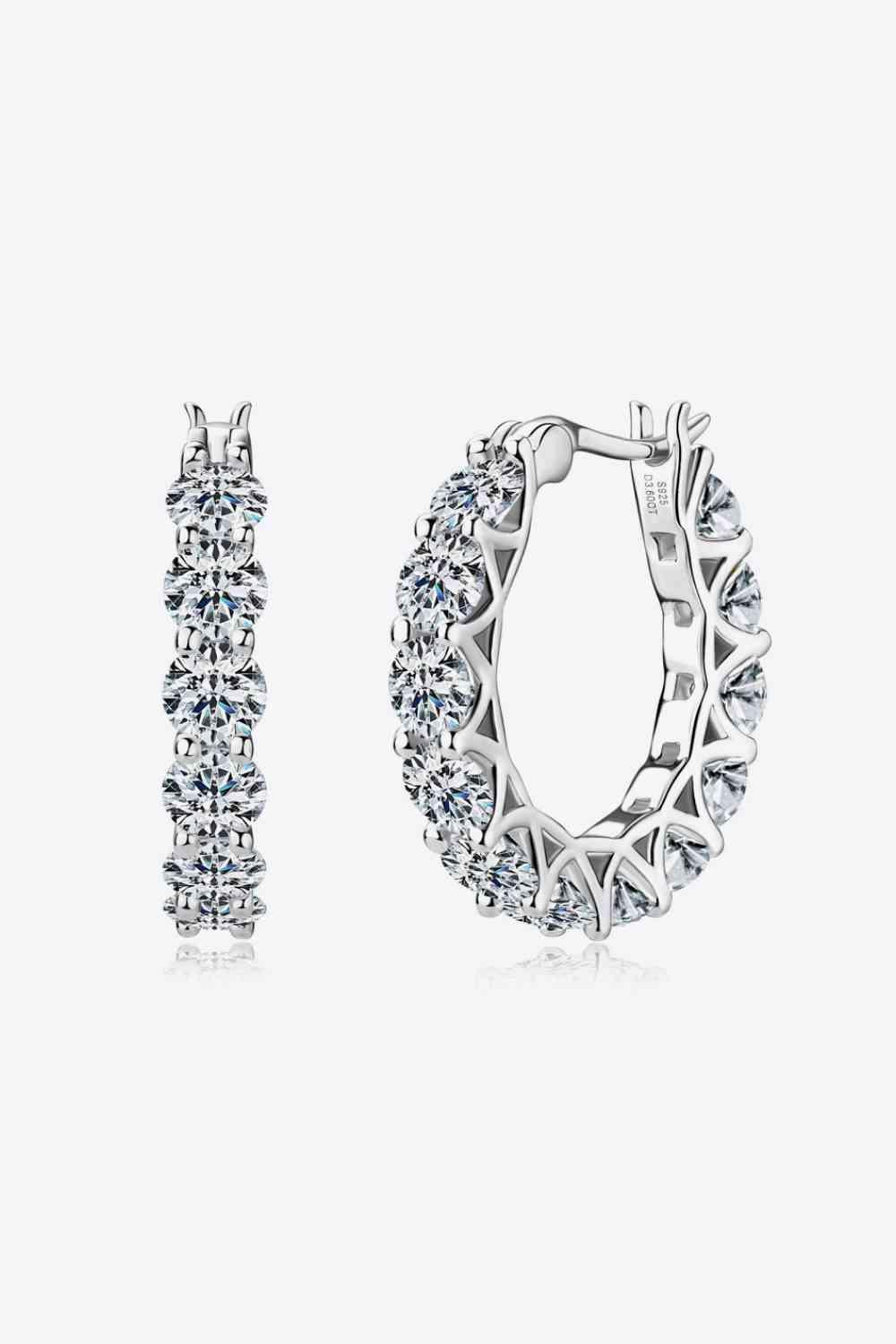 a pair of diamond hoop earrings