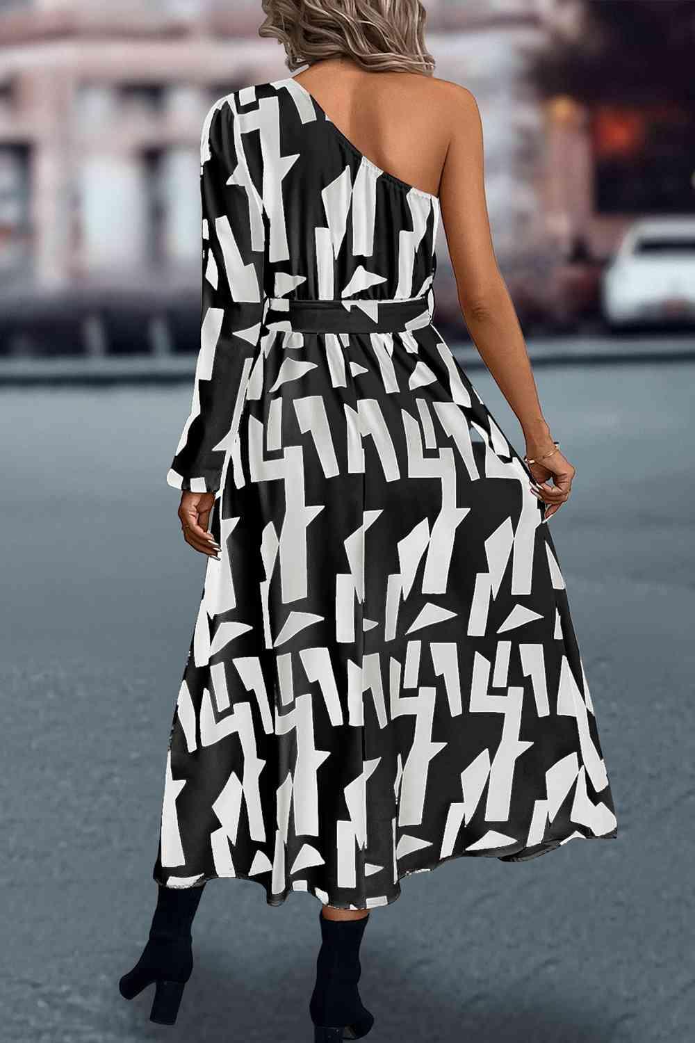 a woman in a black and white dress