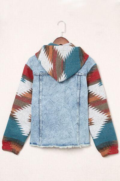a denim jacket with a colorful pattern on it