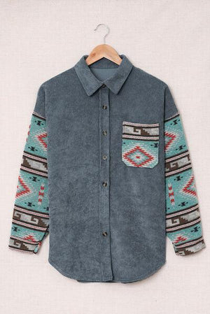 a blue shirt with a colorful pattern on it