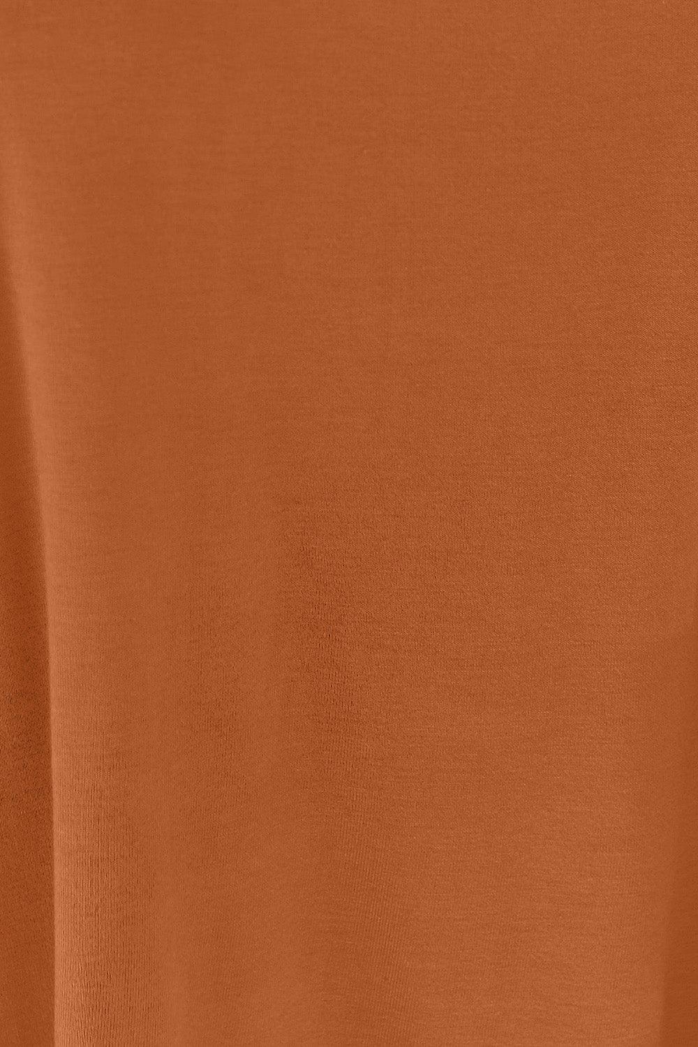 a close up of an orange colored shirt
