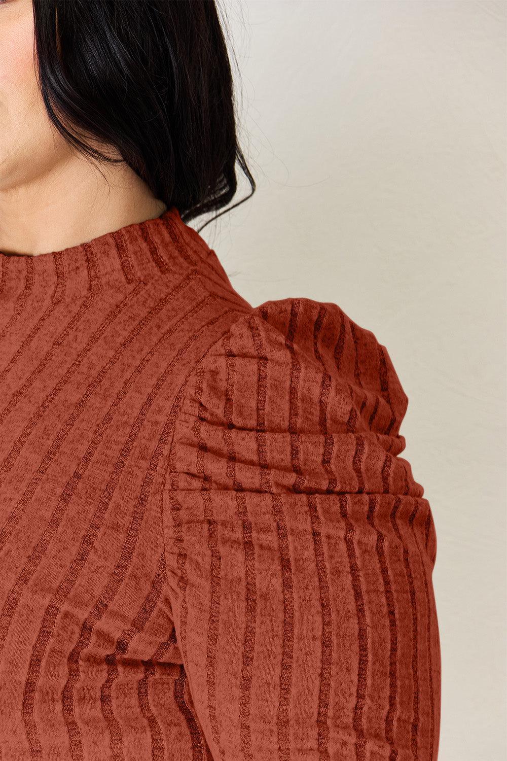 a close up of a person wearing a red shirt