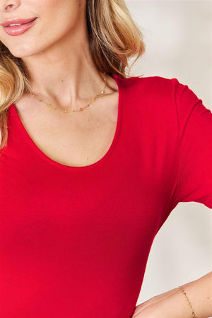 a woman in a red shirt is posing for a picture
