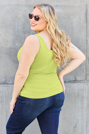 a woman wearing a lime green tank top