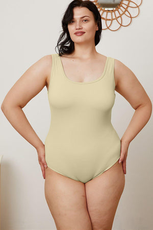 a woman in a bodysuit posing for a picture