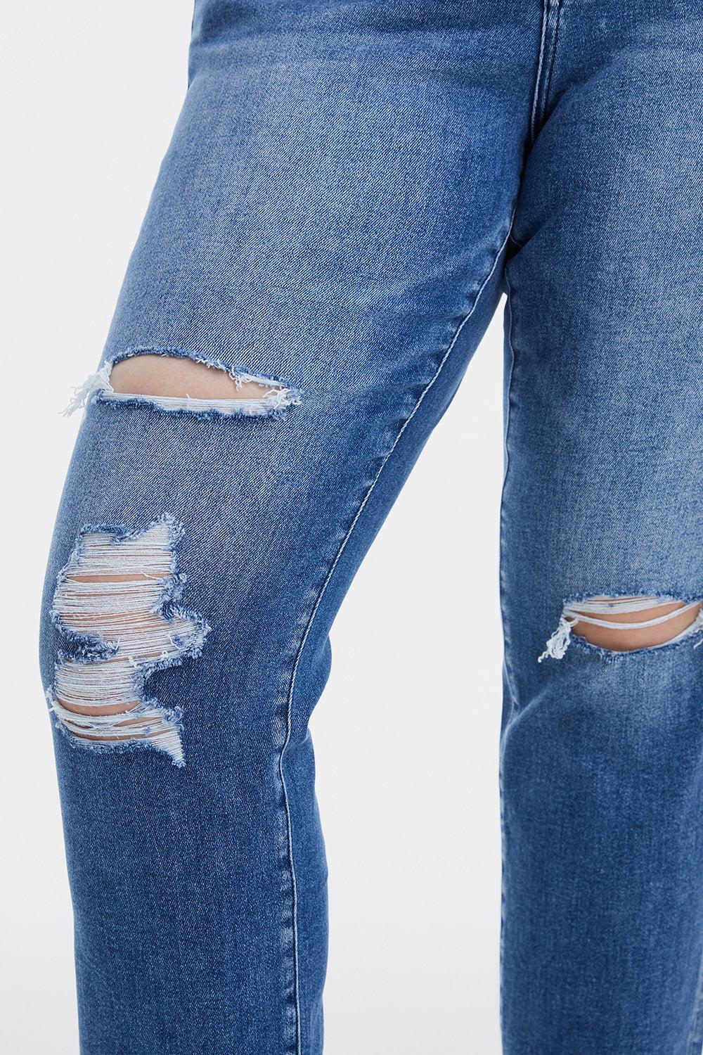a pair of jeans with torn knees and knees