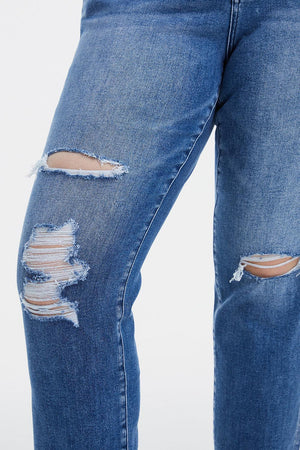 a pair of jeans with torn knees and knees