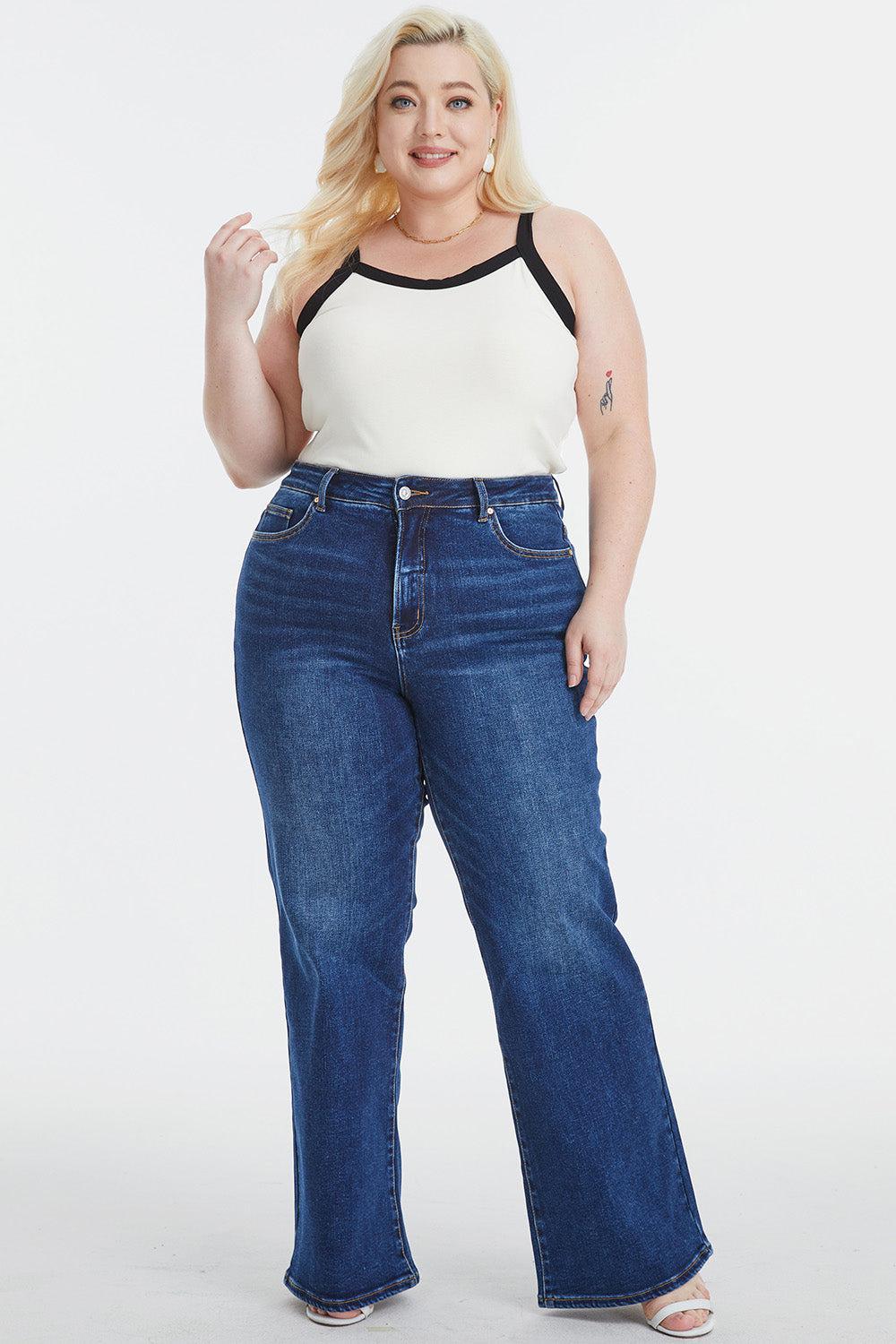 a woman in a white top and blue jeans