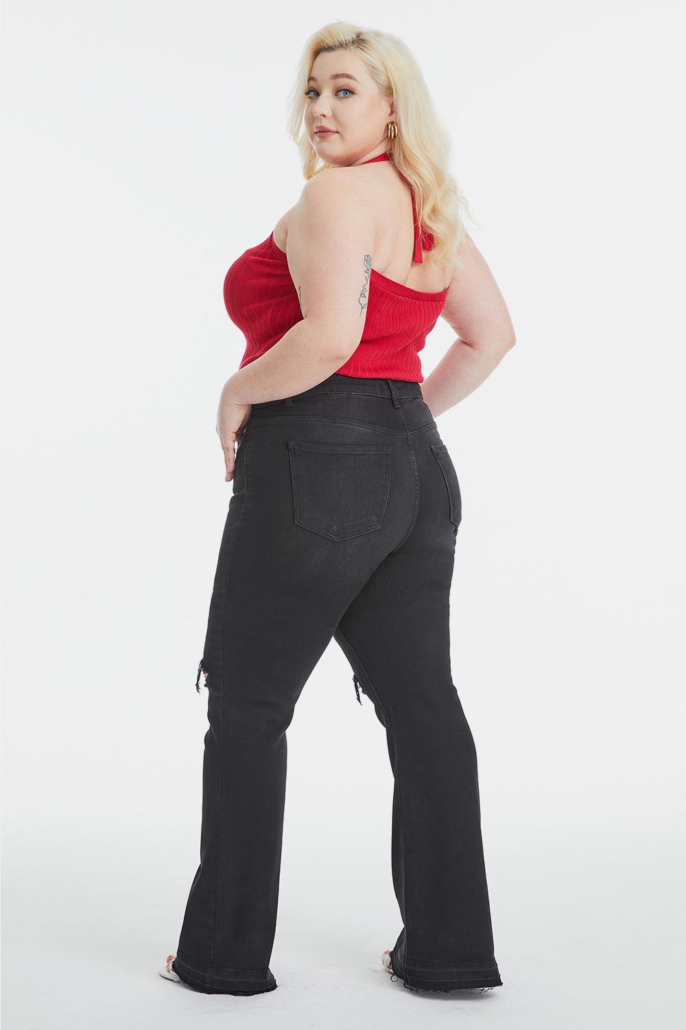 a woman in a red top and black pants