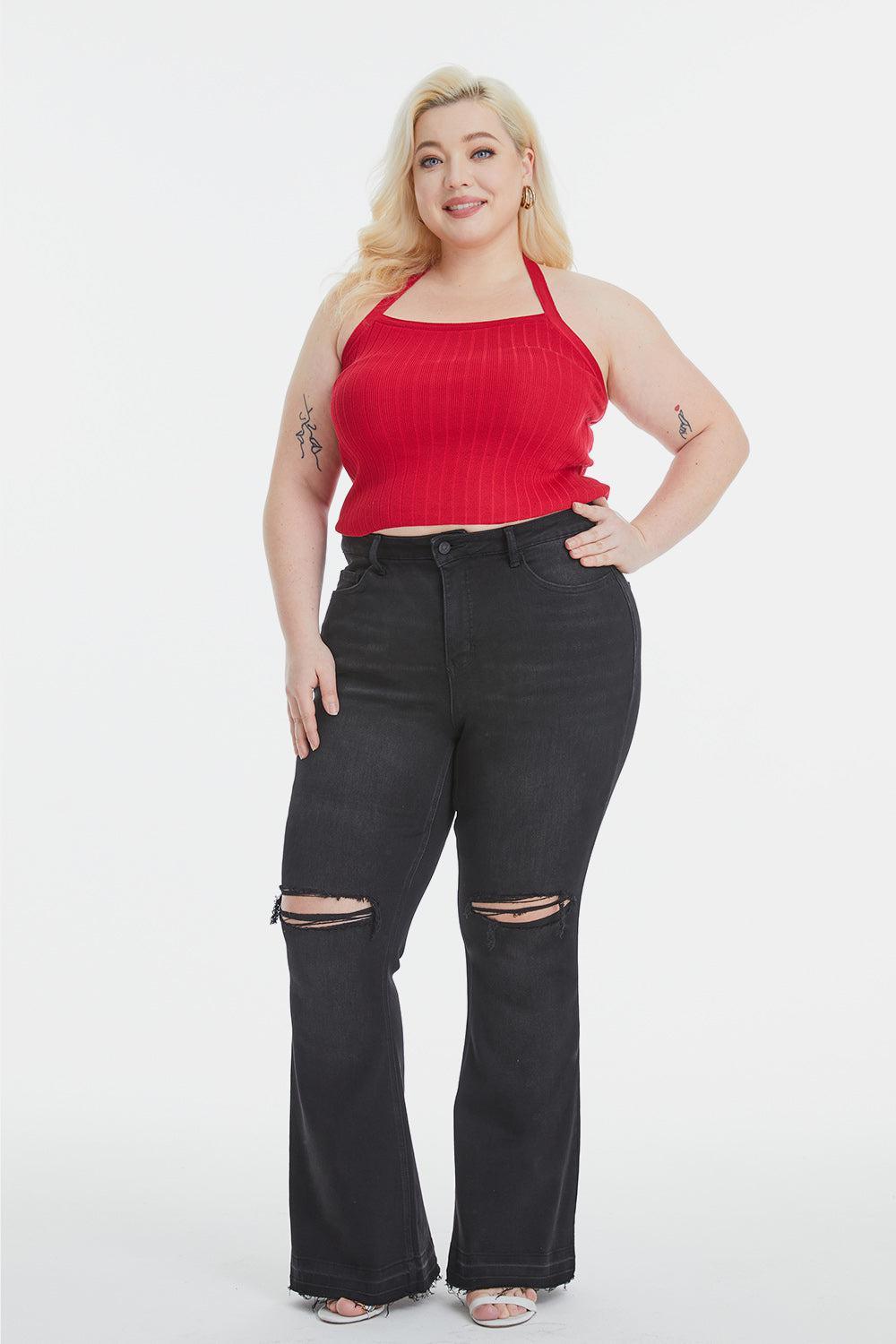 a woman in a red top and black jeans