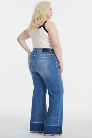 a woman in a white top and blue jeans