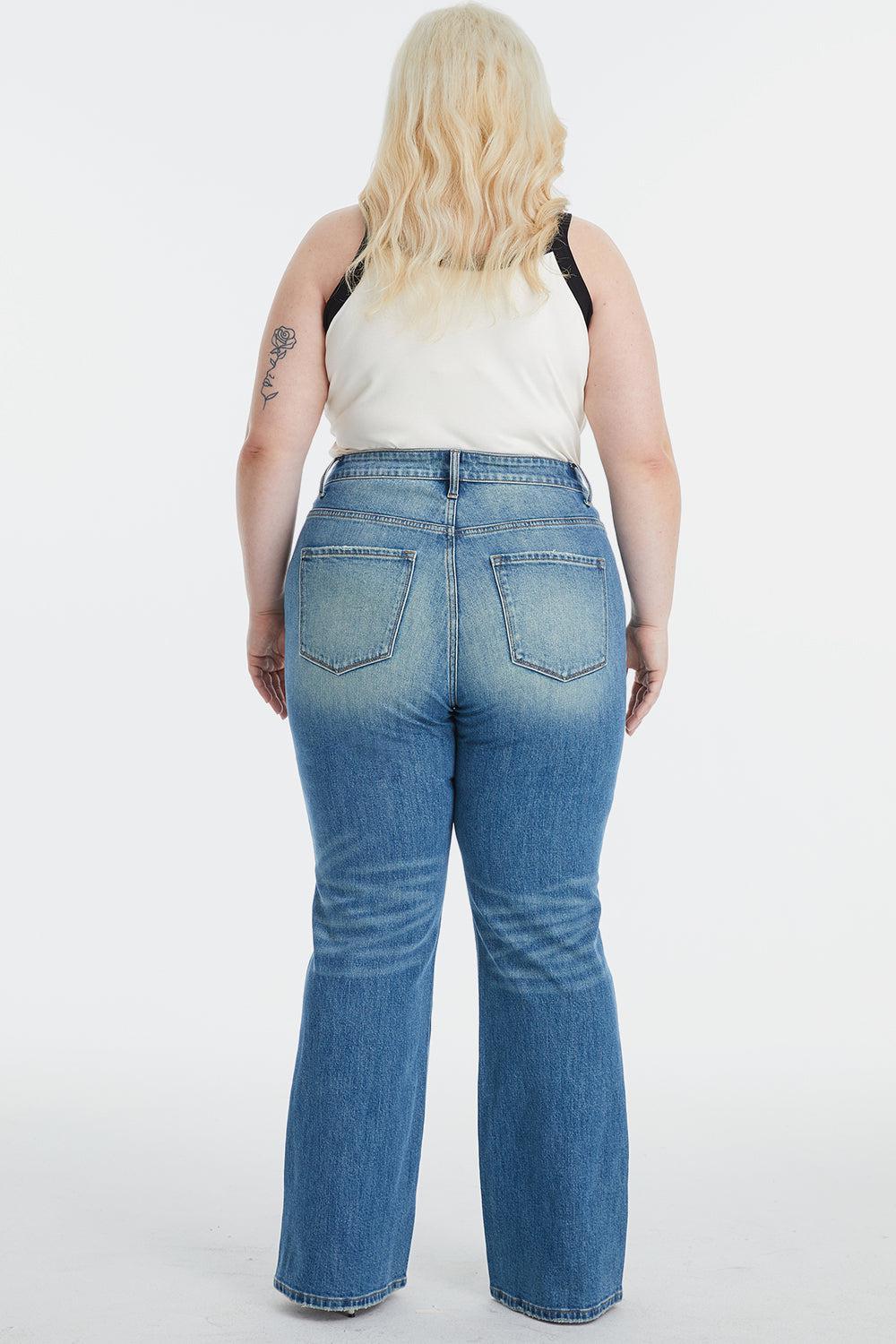 a woman in a white top and blue jeans