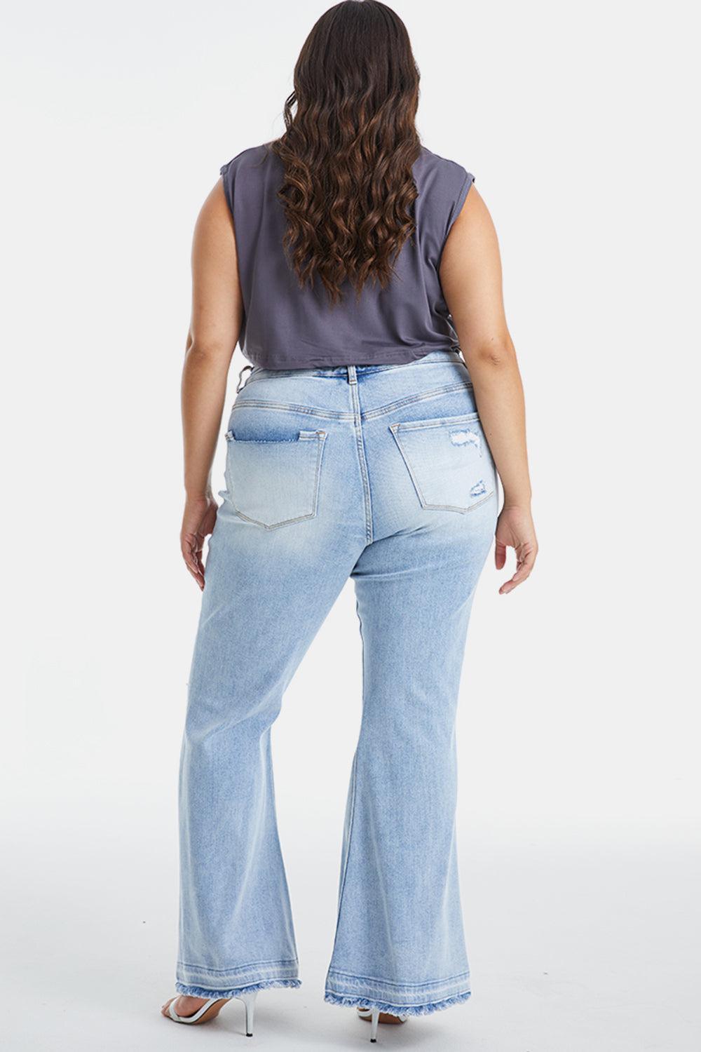 a woman in high rise jeans is facing away from the camera