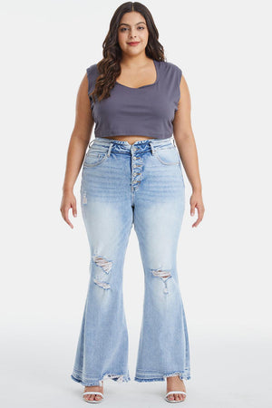 a woman in a cropped top and jeans
