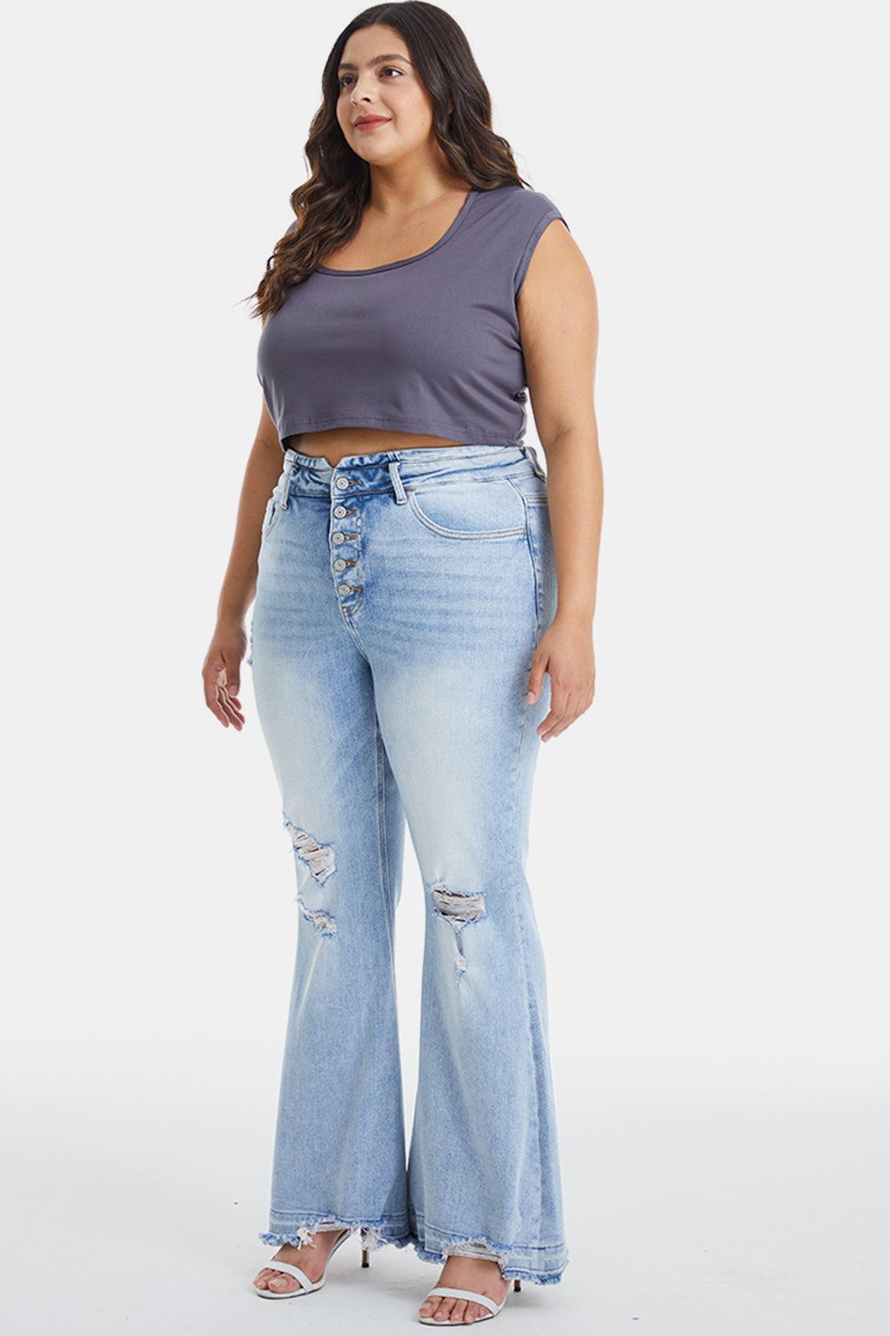 a woman in a cropped top and jeans