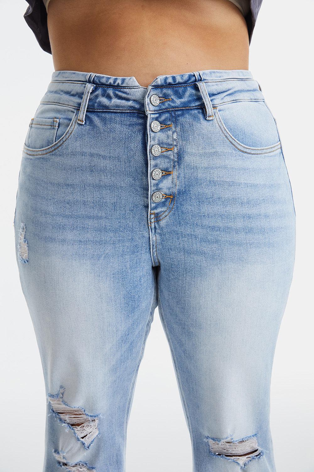 a woman's butt showing her ripped jeans