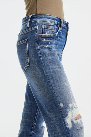 a woman's jeans with a hole in the side