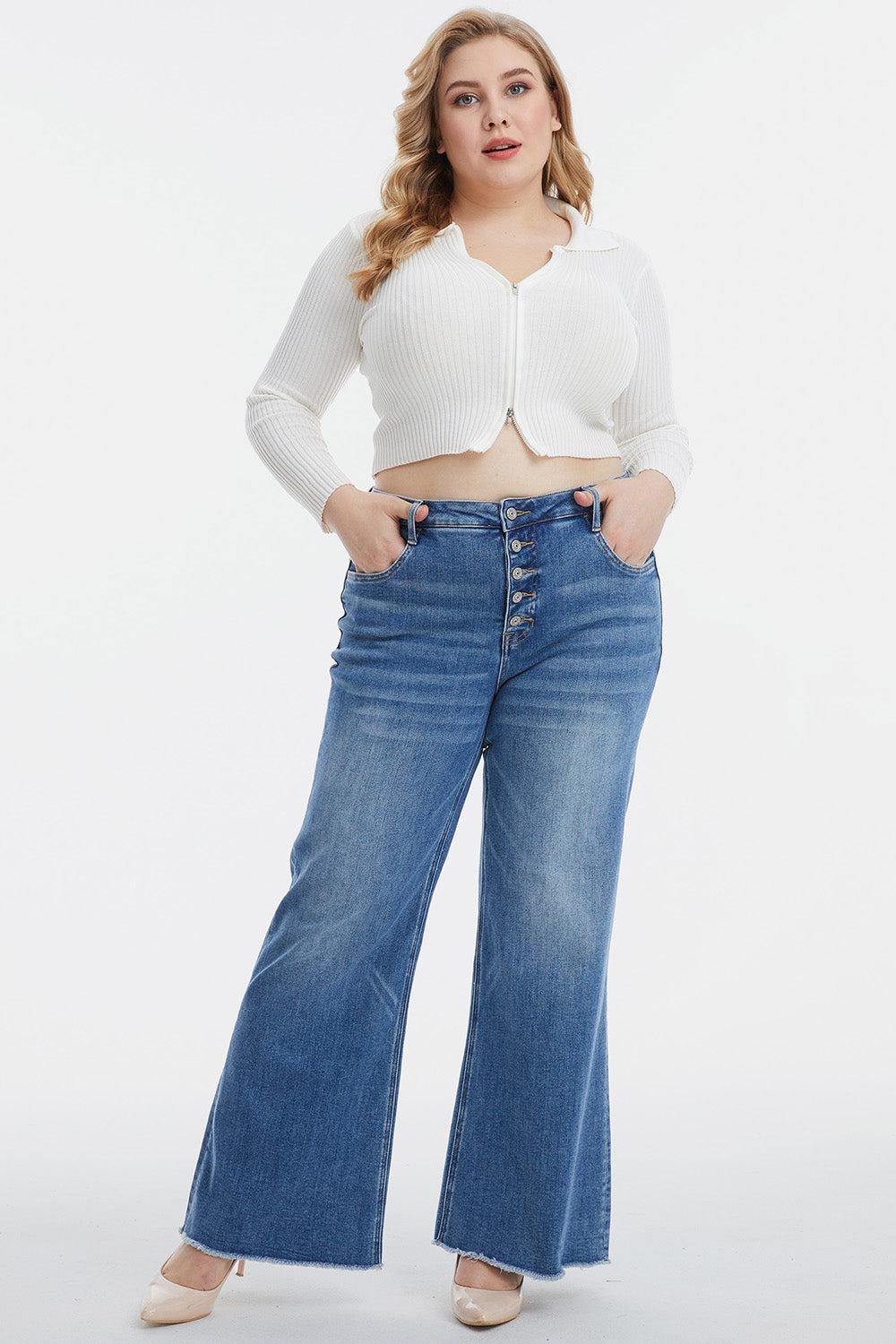a woman in a white crop top and jeans