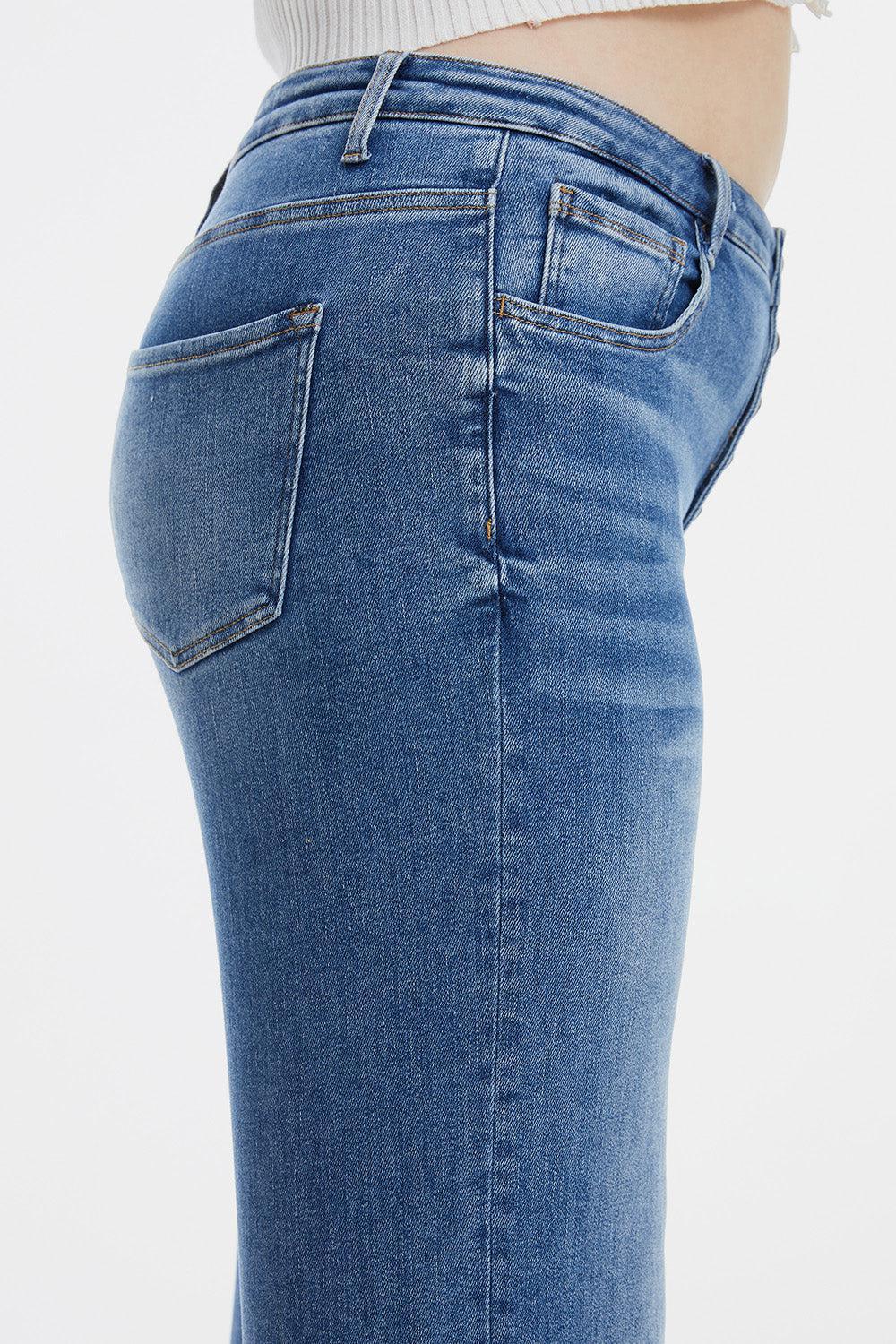 a close up of a woman's butt wearing jeans
