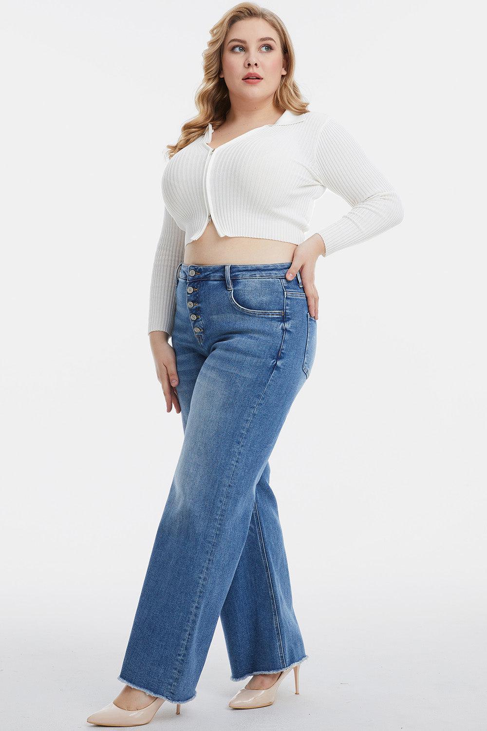 a woman in a white top and jeans