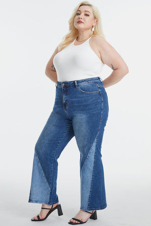 a woman in a white top and blue jeans