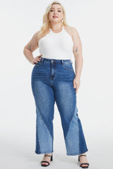 a woman in a white top and blue jeans