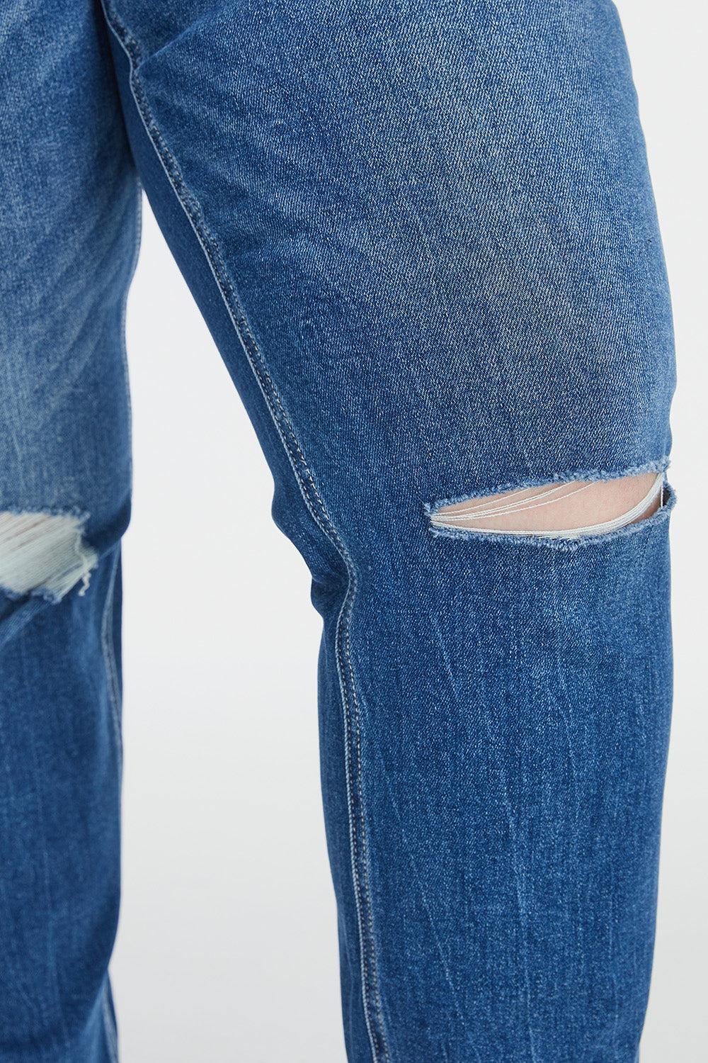 a pair of blue jeans with holes in them