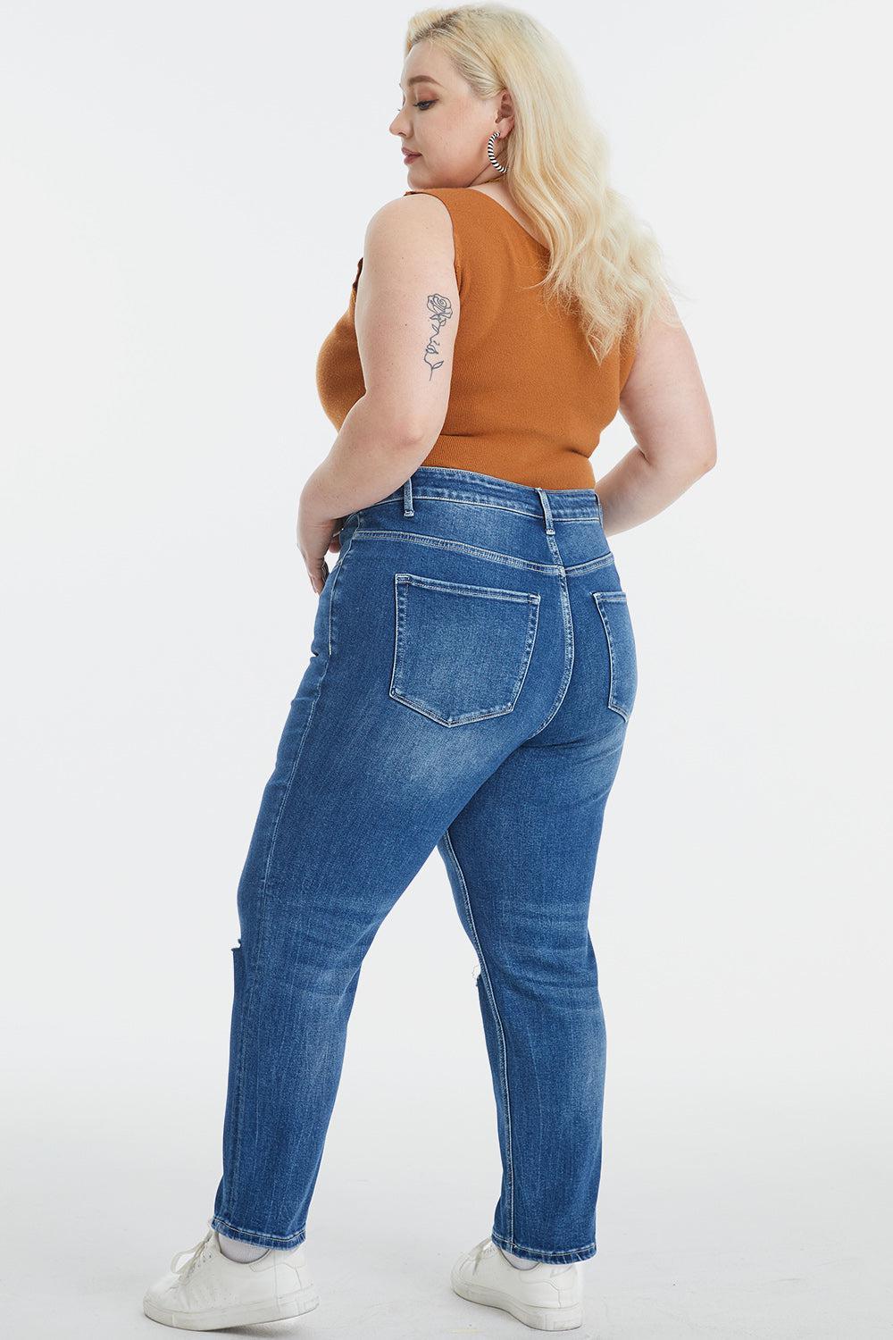 a woman in a brown top and blue jeans
