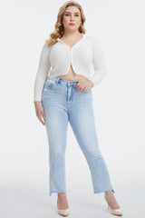 a woman in a white top and jeans