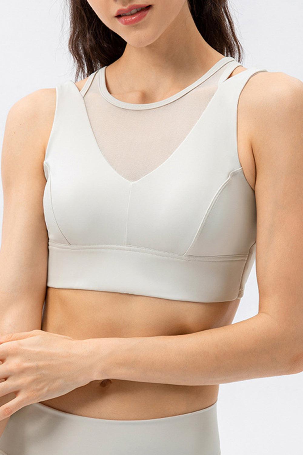 a woman wearing a white sports bra top