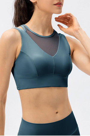 a woman in a blue sports bra top