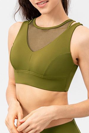 a woman in a green sports bra top