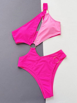 two pieces of pink swimsuit on a grey and white background