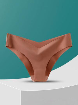 a woman's panties on a pedestal against a green background