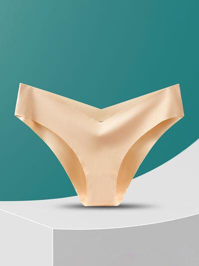 a pair of underwear sitting on top of a white pedestal