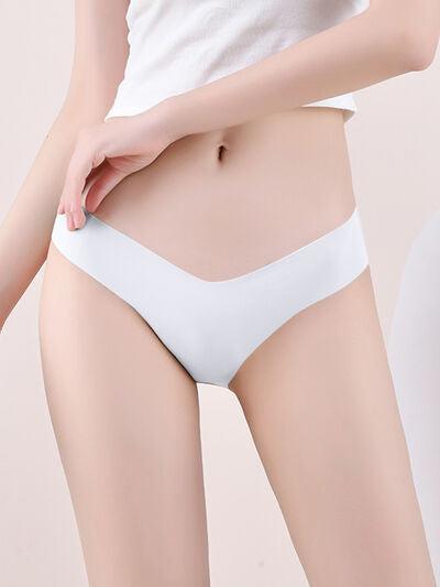 a woman wearing a white underwear and panties